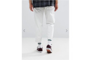 Skater Jeans In White With Heavy Rips