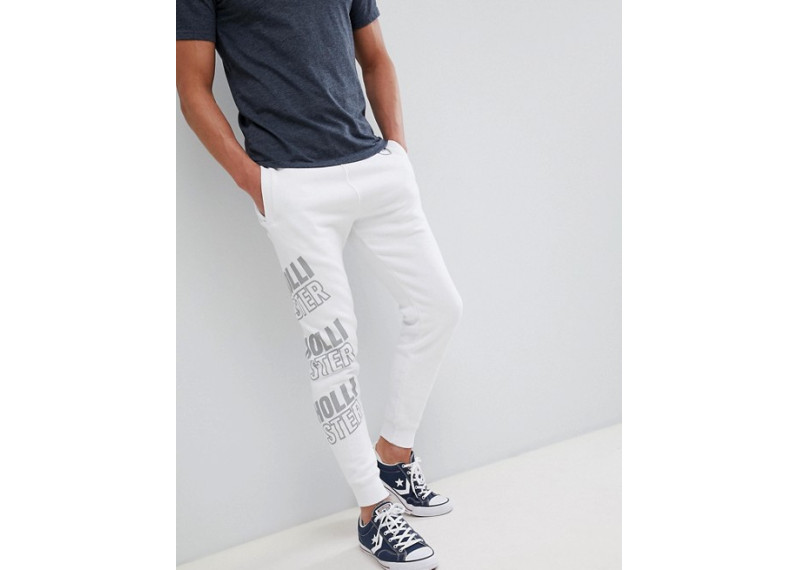 Hollister all over print logo super skinny joggers in white